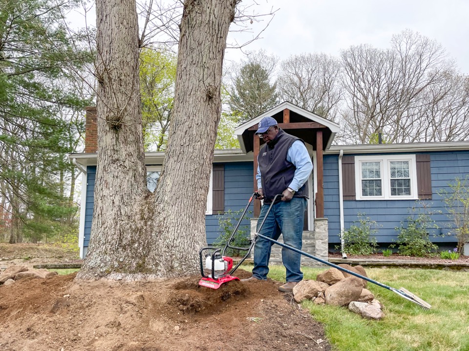 Tilling soil in a front yard